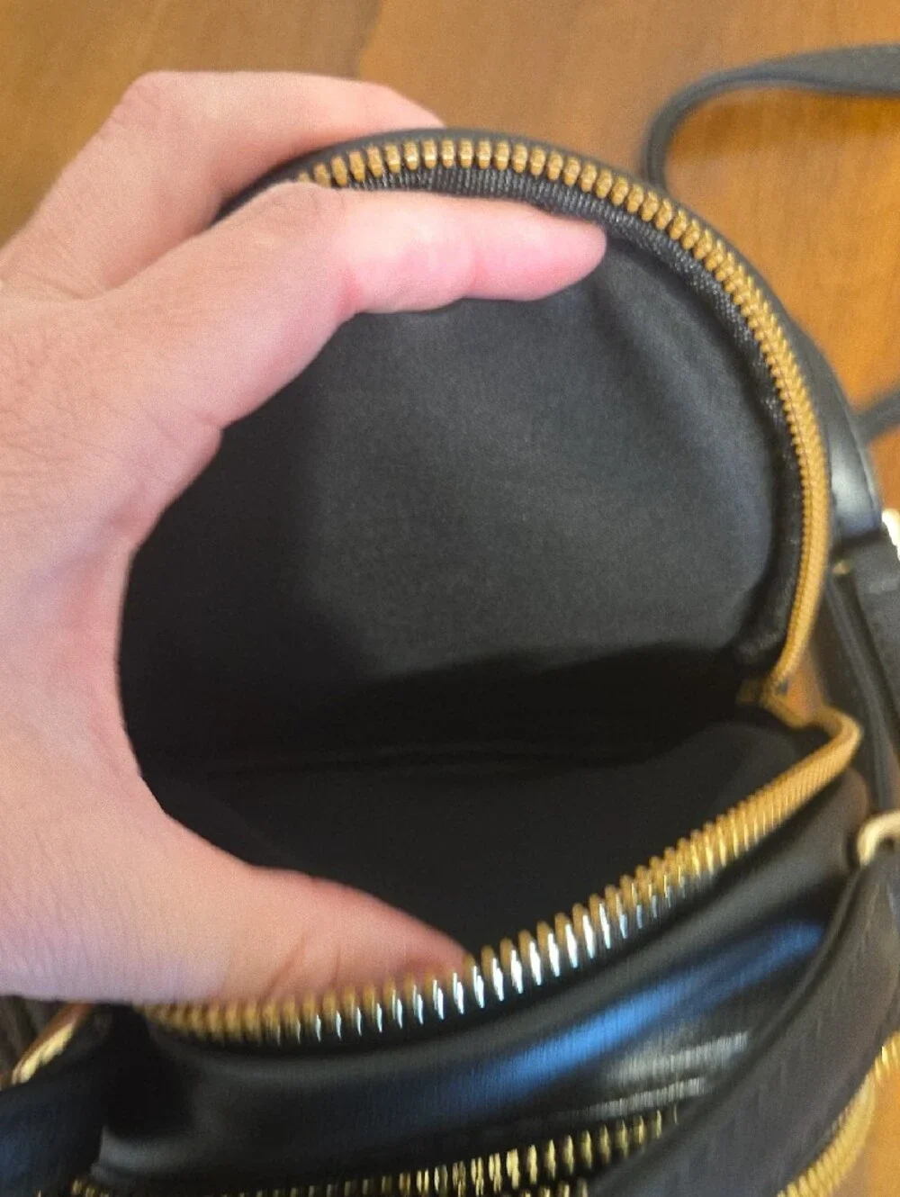 Black Crossbody Bag with Gold Bee Emblem